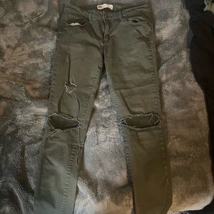 Ripped army green skinny jeans